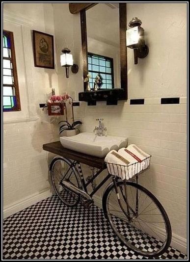 Creative idea to use a bike as a home decor, especially the basket as a place to hold things.