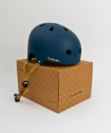 e Cyclechic 'Deco' Ladies Navy Blue Helmet on top of box